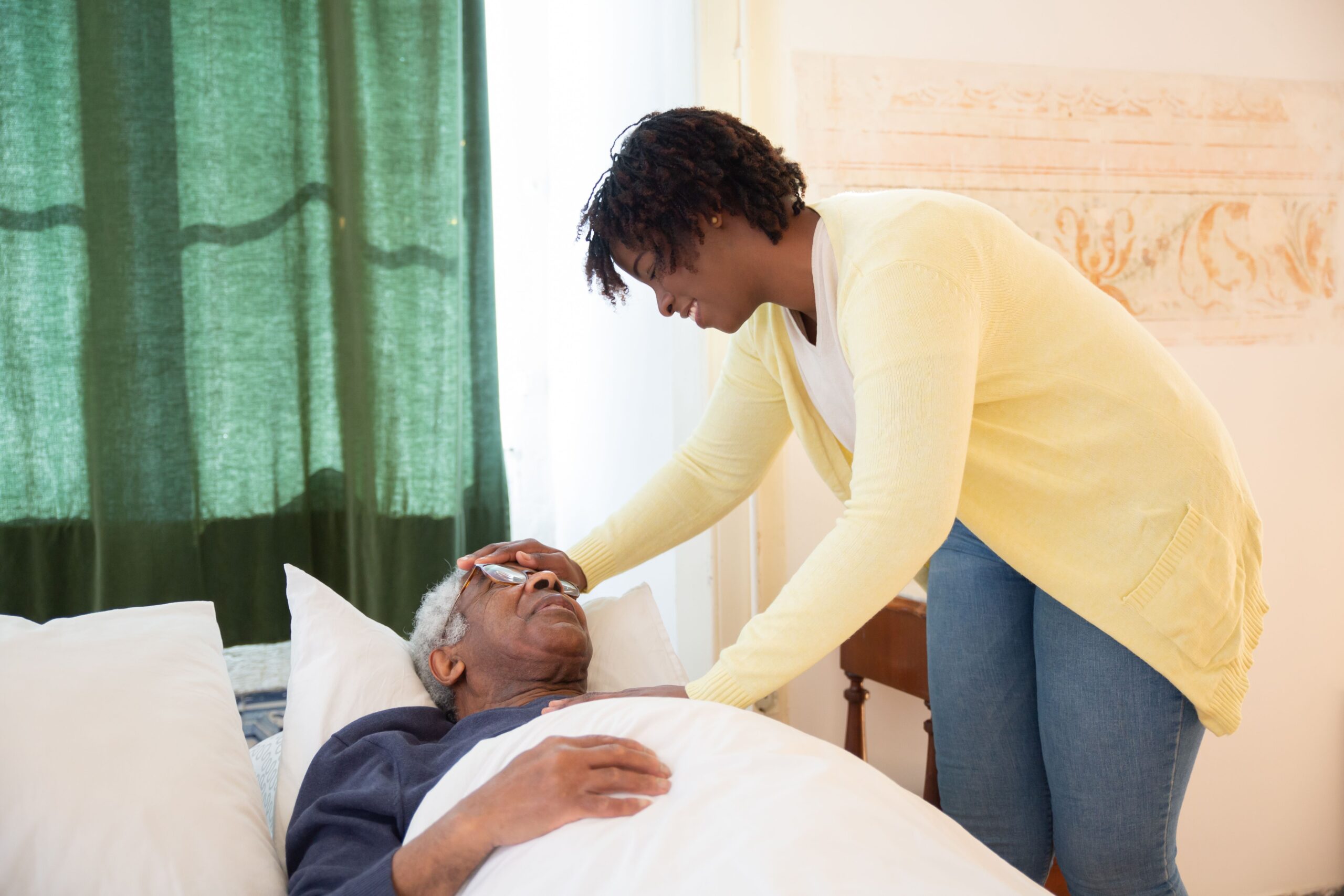 Caregiver providing compassionate in-home support to an older adult.
